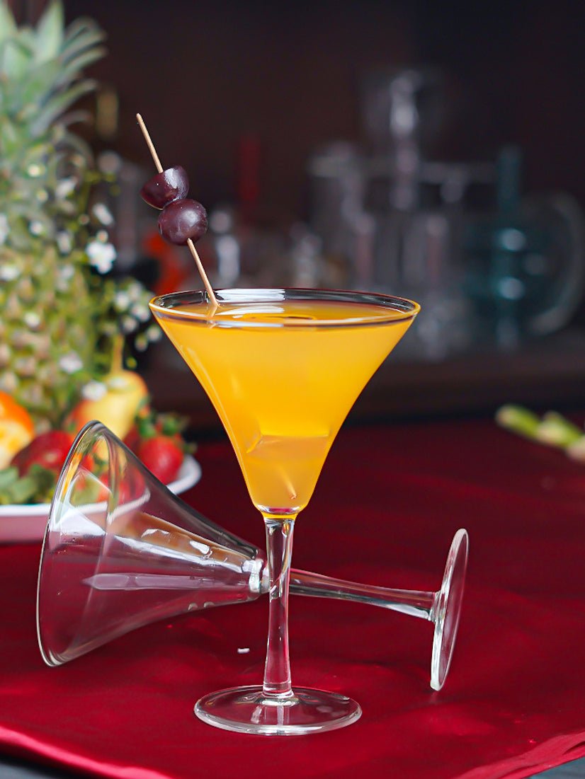Transparent borosilicate martini glass showcasing its wide bowl and sleek stem, ideal for elegant drink serving.